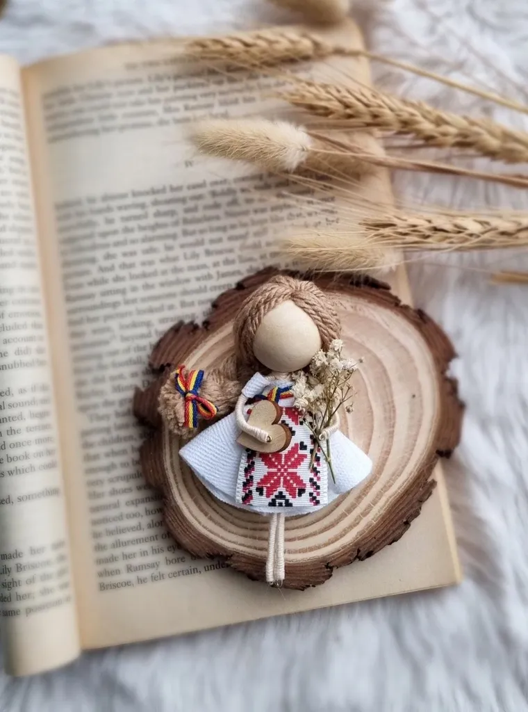 Doll in a traditional embroidered dress on a wood slice