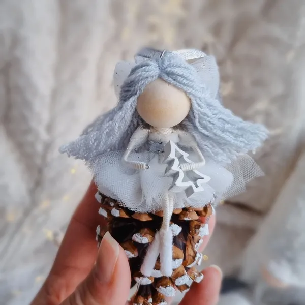 Christmas angel on a pine cone