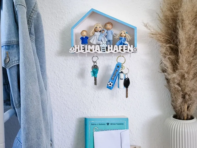 Personalized family key holder on a wall