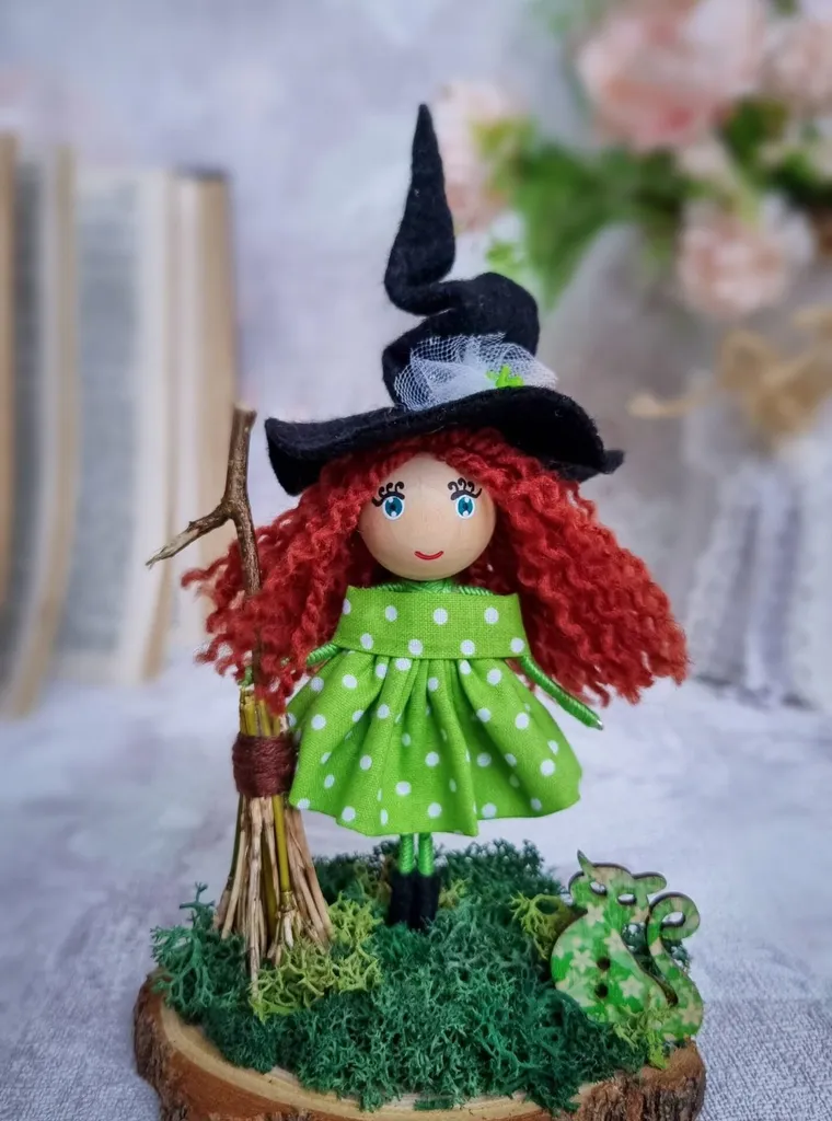 Holiday doll — red-haired witch on a wood slice